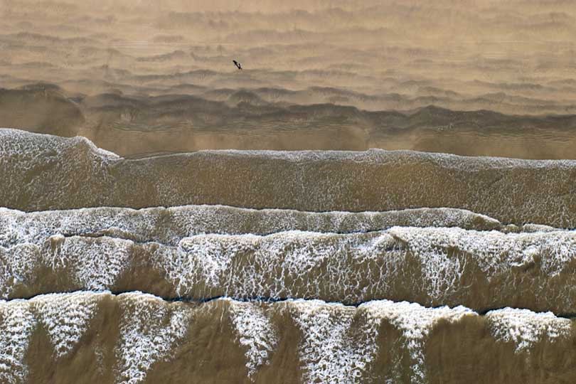 Person walking on a beach, aerial view, Pwani Region, Tanzania